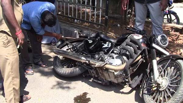 A snake in a young mans two-wheeler 