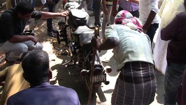 A snake in a young mans two-wheeler 