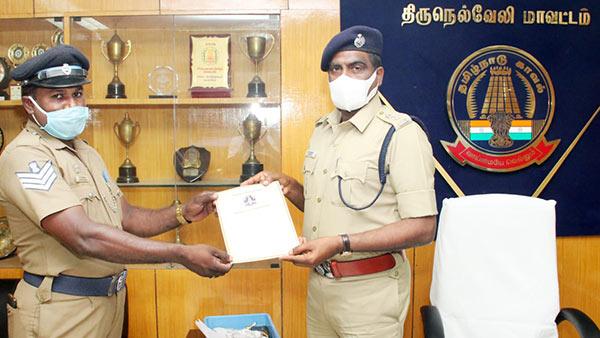 head Constable Jagadeesh sweeping Gravel scattered on road near Panakudi in Nellai 