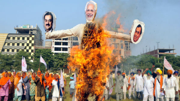 Punjab Farmers burn effigies of PM Modi, Ambai, Adani Punjab Farmers burn effigies of PM Modi, Ambai, Adani