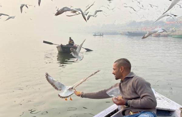 Dhawan feeds birds amid bird flu in Varanasi 