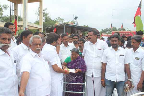 Dmk District secretary financial assistance to a woman suffering from cancer 