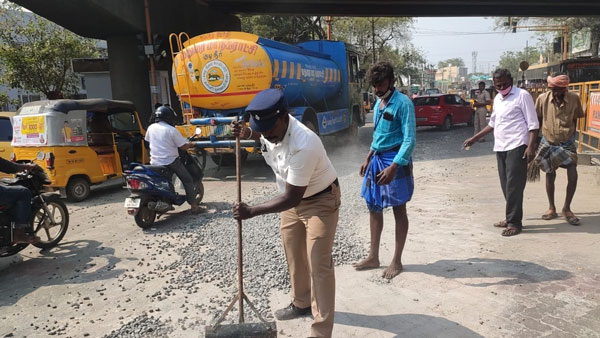 Police clears gravel on NH road which make riders safe journey
