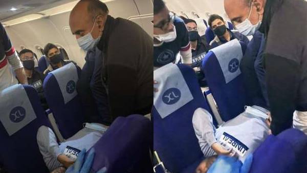 பயணியை பரிசோதித்த அமைச்சர் 