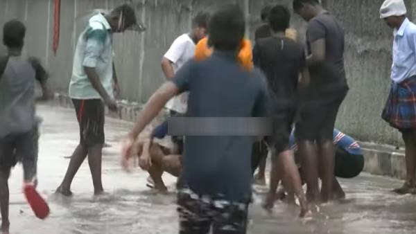 Boys and youths fishing on the main road in Chennai T.Nagar Boys and youths fishing on the main road in Chennai T.Nagar
