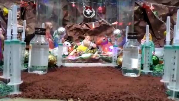 தடுப்பூசி கொண்டு குடில் 