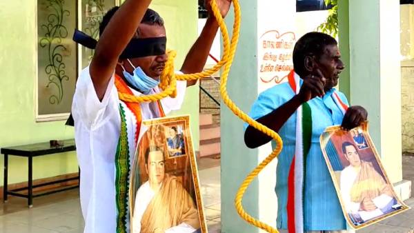 கழுத்தில் தூக்கு கயிற்றுடன் போராட்டம் கழுத்தில் தூக்கு கயிற்றுடன் போராட்டம்
