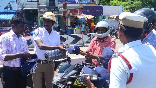 Traffic police provide cool drinks for who follow traffic rules Traffic police provide cool drinks for who follow traffic rules