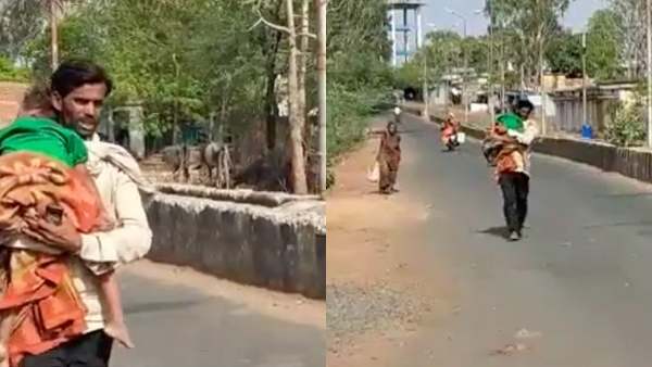 தோளில் சுமந்த தந்தை 