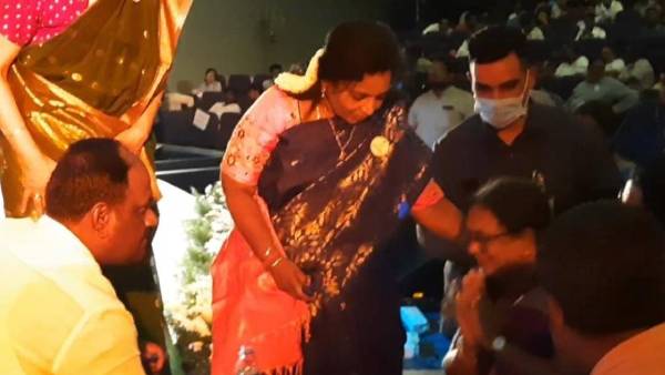 Tamilisai Soundararajan gives first aid to a woman who falls in the stage Tamilisai Soundararajan gives first aid to a woman who falls in the stage