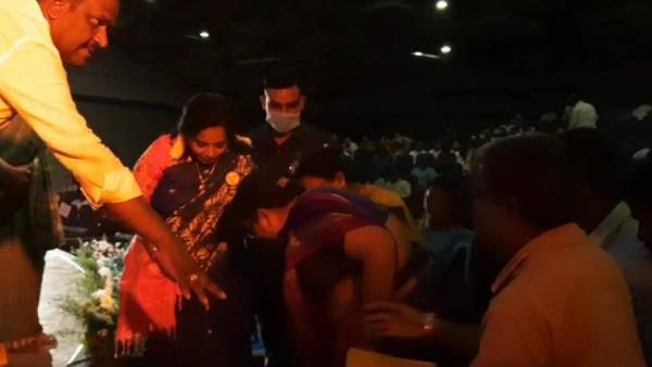 Tamilisai Soundararajan gives first aid to a woman who falls in the stage Tamilisai Soundararajan gives first aid to a woman who falls in the stage