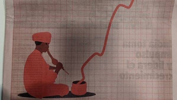 பாம்பாட்டி ஒருவர் கையில் மகுடியுடன்