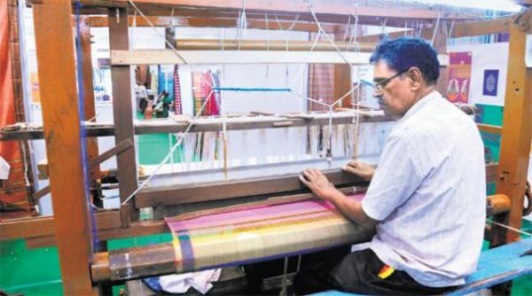 what achievements have been made for the weavers during the DMK regime. 