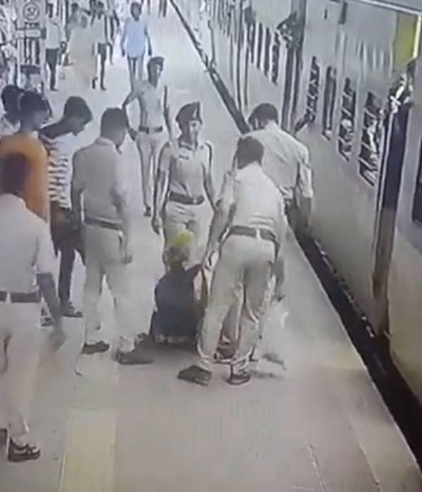  RPF woman officer saving a passenger from falling under a moving train 