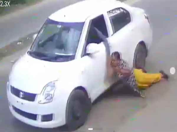 CCTV Woman nearly run over as car-borne thieves snatch gold chain from her Two Arrested in Coimbatore 