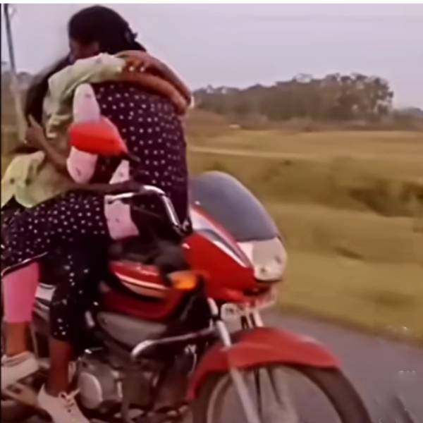 Who is this young woman and kissing harsh bike riding by the young girls 