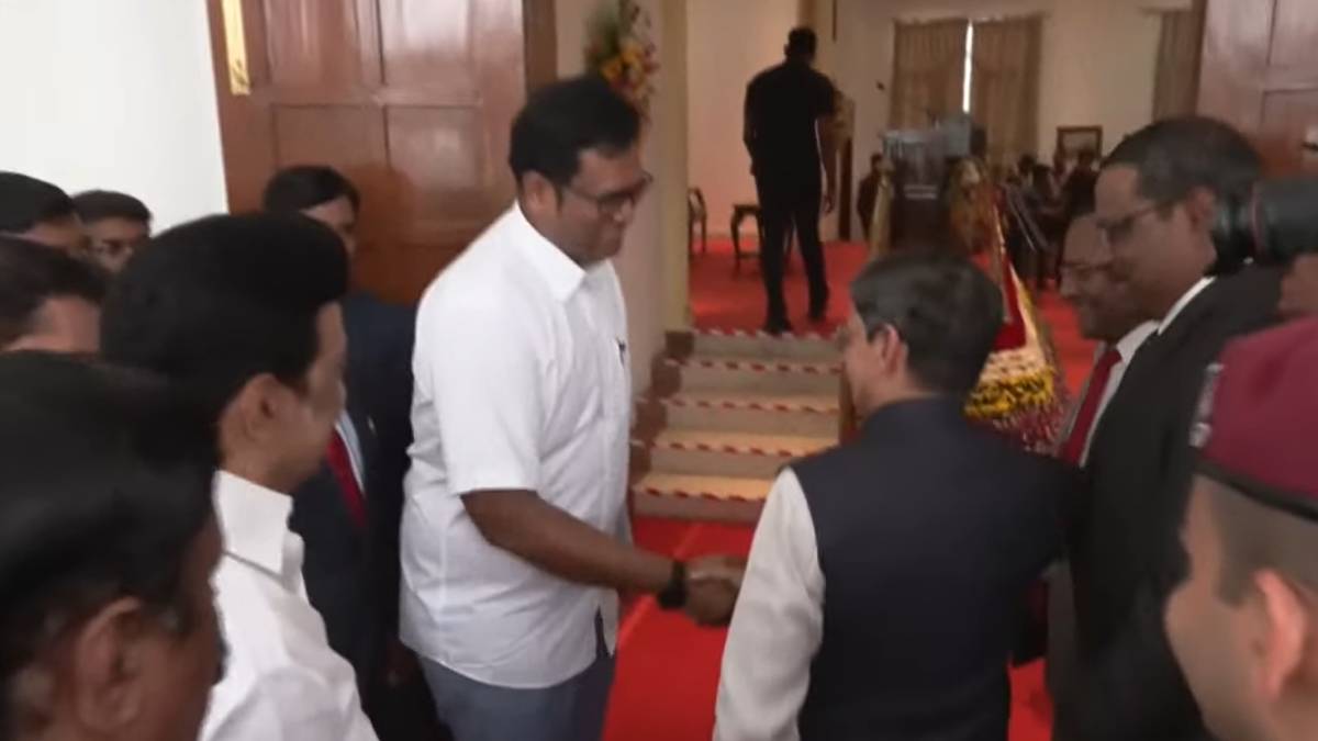 Governor RN Ravi holding the hand of DMK TRP Raja after the ministerial oath and says this Governor RN Ravi holding the hand of DMK TRP Raja after the ministerial oath and says this