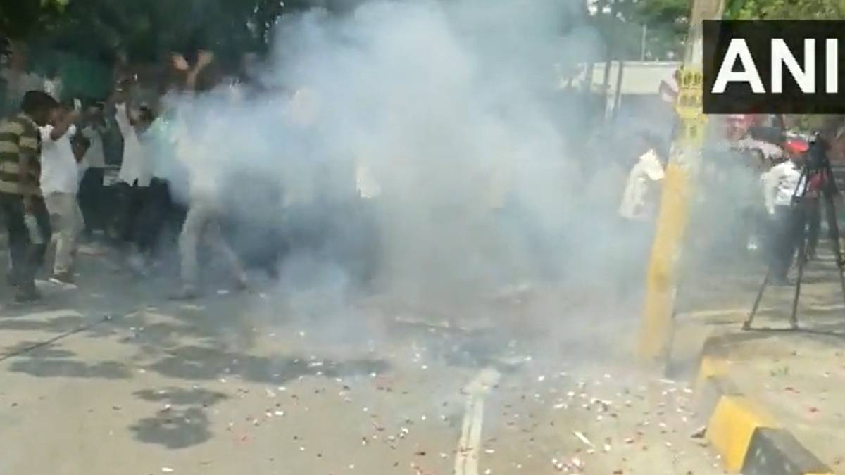 Supporters celebrate by bursting firecrackers as news emerges that Siddaramaiahs name has been nominated as the CM of Karnataka 