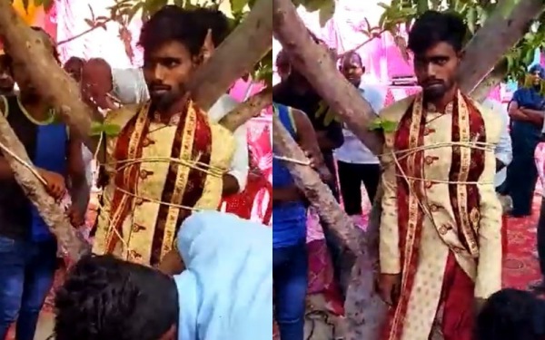 UP brides family tied the groom to a tree for demanding dowry UP brides family tied the groom to a tree for demanding dowry