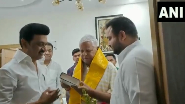Tamil Nadu CM MK Stalin touches the feet of RJD chief Lalu Prasad Yadav as he meets him in Patna 