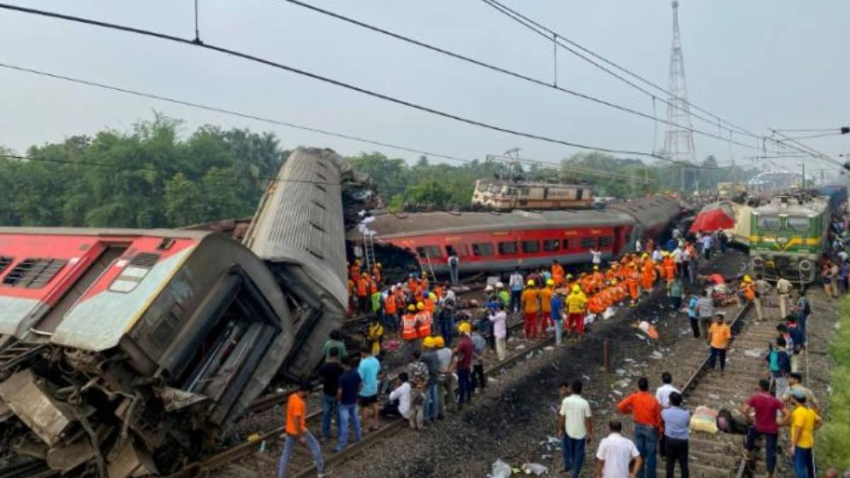  A father searching his son among the dead bodies in Odisha train accident spot 