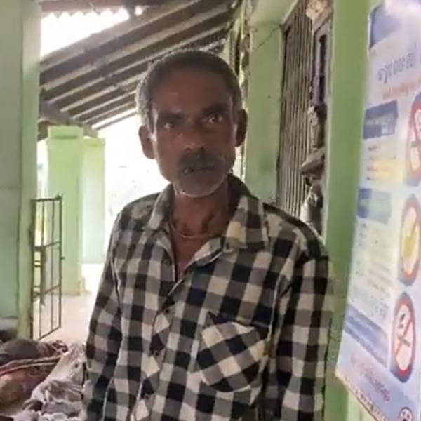  A father searching his son among the dead bodies in Odisha train accident spot 
