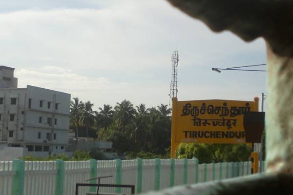 The officer who did not know Tamil at Tiruchendur railway station; train left before giving the ticket 