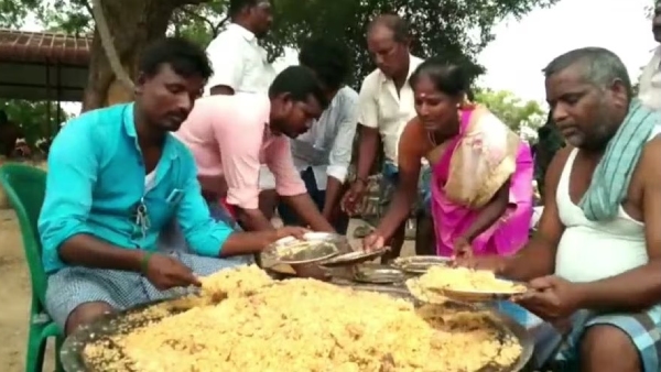 A village president had a biryani feast for villagers who had worked on the 100-day work scheme 