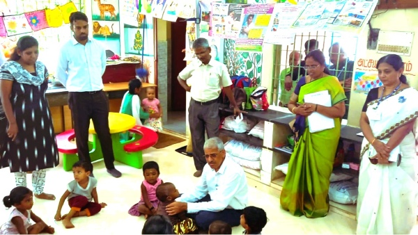 Shivdas Meena sitting on the floor as a child with children! Importance of direct field inspection!