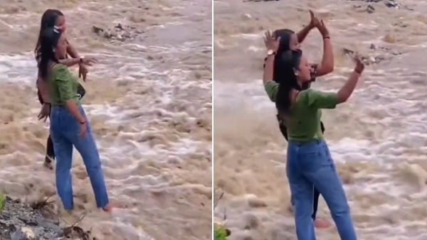 video: Young women make TikTok videos before wild floods run down the road 