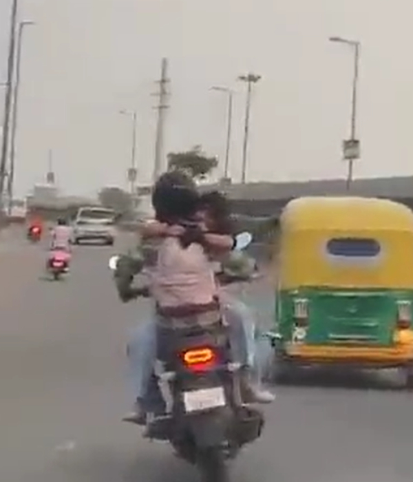 Youth who had a romance with his girlfriend while riding a bike in delhi busy road Youth who had a romance with his girlfriend while riding a bike in delhi busy road