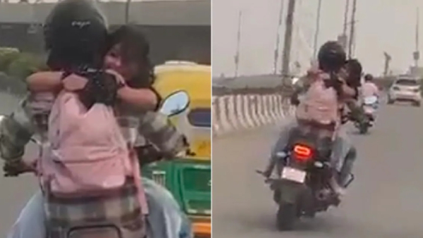 Youth who had a romance with his girlfriend while riding a bike in delhi busy road Youth who had a romance with his girlfriend while riding a bike in delhi busy road