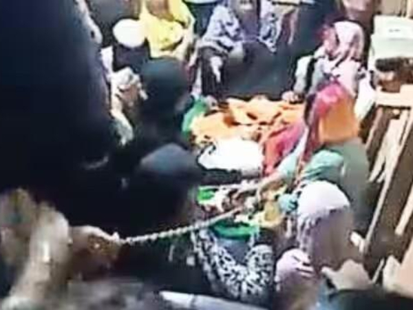 Parents Attend Burial In Handcuffs as their Baby Dies At Refugee Detention Centre Parents Attend Burial In Handcuffs as their Baby Dies At Refugee Detention Centre