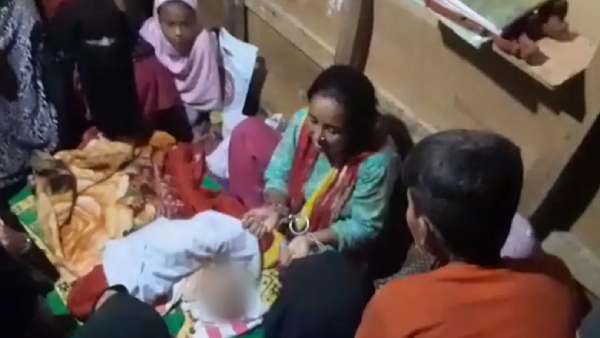 Parents Attend Burial In Handcuffs as their Baby Dies At Refugee Detention Centre Parents Attend Burial In Handcuffs as their Baby Dies At Refugee Detention Centre