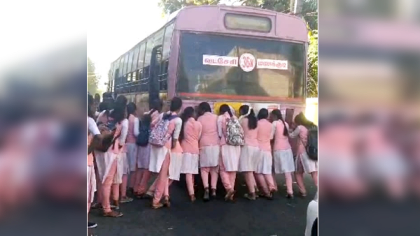 college students pushing a broken down bus in Nagercoil : temporarily suspended driver and conductor 