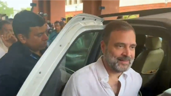Rahul gandhi return back to Parliament Lok Sabha with white shirt 