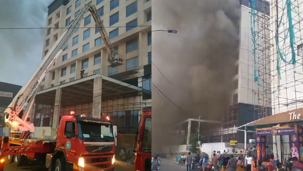 Fire mans breaking the glasses by throwing stones for trying to control fire in Chennai 9-storey building 