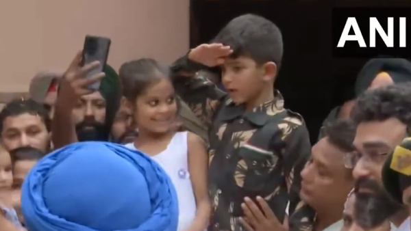 A 6-year-old son in military uniform paid tribute to his father, who died in a terrorist attack 