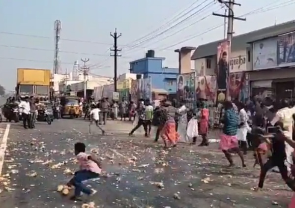 Vijay fans broke hundred of coconuts on road made traffic jam Vijay fans broke hundred of coconuts on road made traffic jam