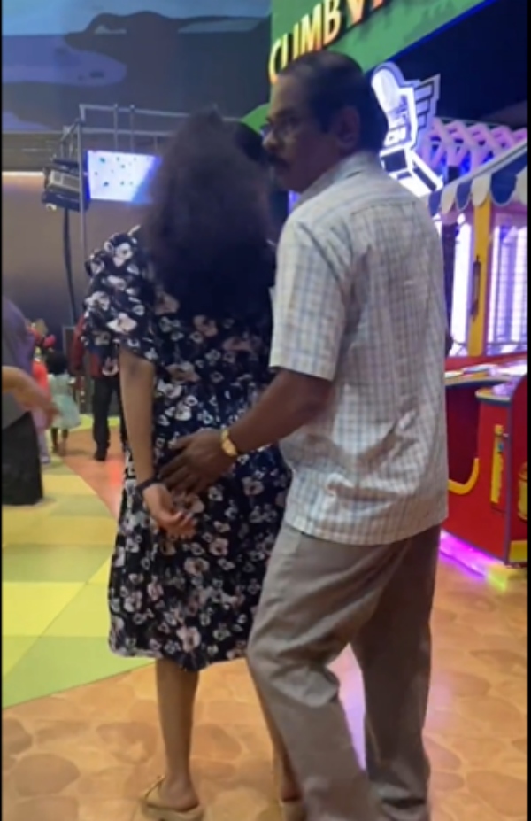  A video of an elderly man behaving indecently with a woman at lulu mall in bangalore 