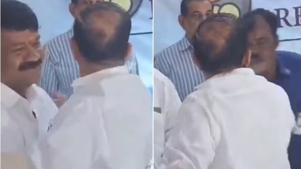 Telangana Home Minister Mahmood Ali Losing his cool and slaps Guard Over Missing Bouquet 