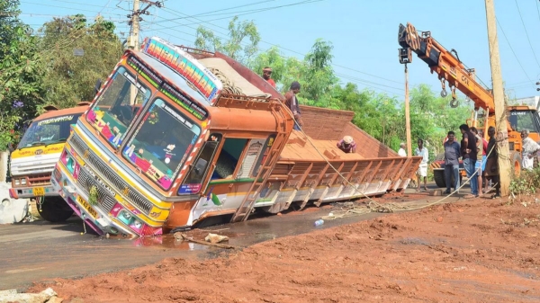 Lorry buried on newly laid road near coimbatore