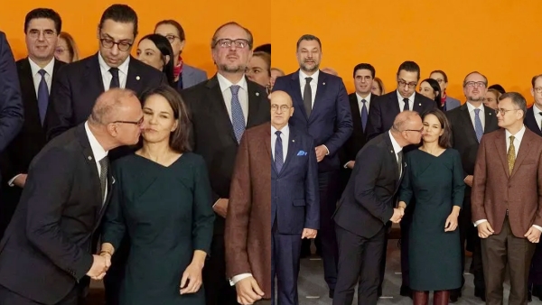 Croatian Foreign Minister Gordon Grlic Radman trying to kiss Germany Minister Annalena Baerbock 