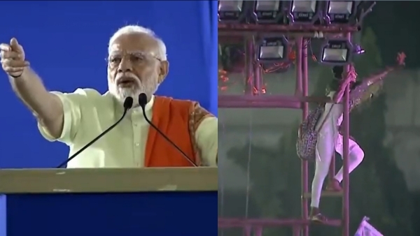  Modi says Come down after woman climbs up tower at PMs rally in Telangana