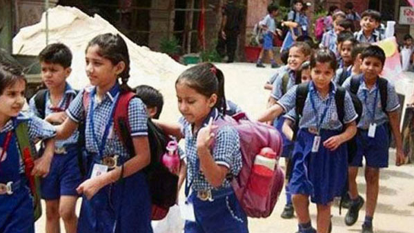 How a district collector ensured hunderds of students from re joining in school after dropping out? 