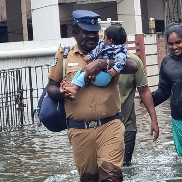 Police explains about the moment he smiles at the child during chennai flood rescue work Police explains about the moment he smiles at the child during chennai flood rescue work