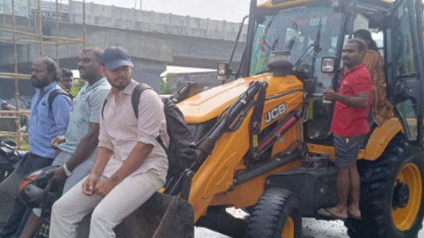 IT employees going to work in JCB vehicle amid chennai flood