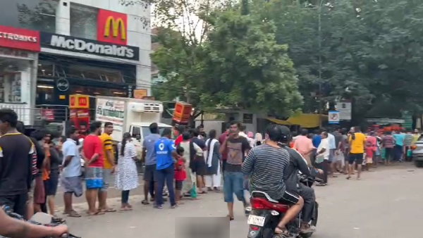 Very long queue to get milk in chennai as supply affected due to Cyclone Michaung