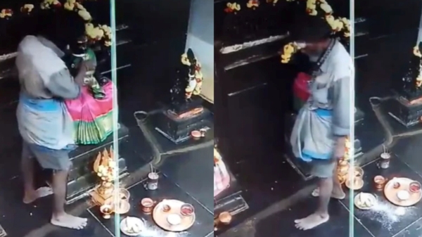 A man silently steals jewelry from Amman Kovil in Vellore after worshiping the god
