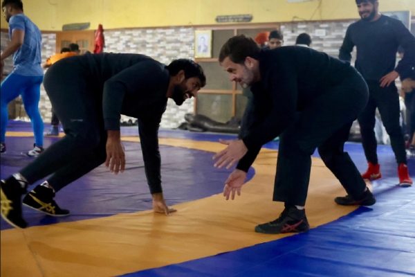 Rahul Gandhi and Bajrang Punia practising wrestling on a mat in Haryana Rahul Gandhi and Bajrang Punia practising wrestling on a mat in Haryana